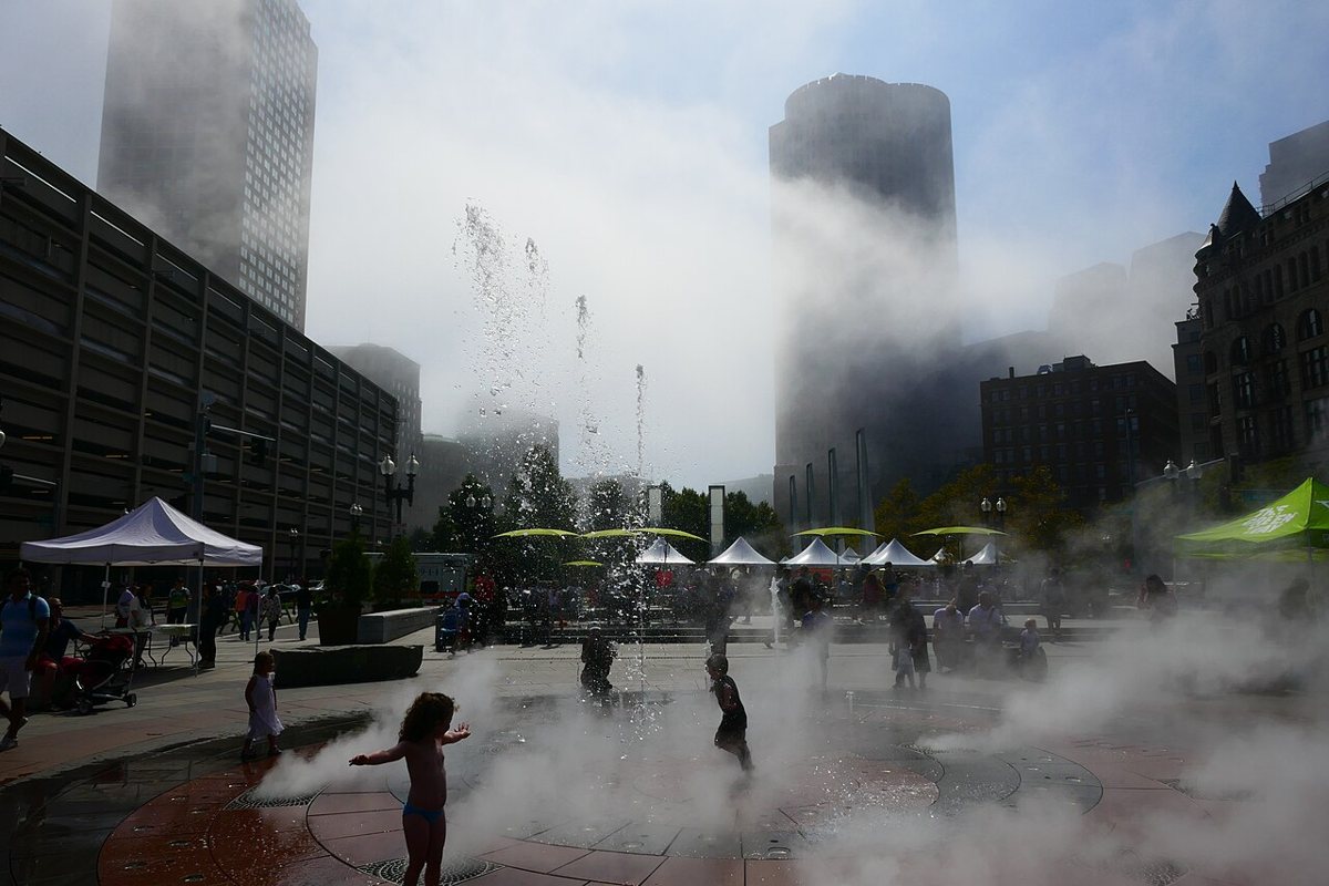 families and food trucks along the Rose Kennedy Greenway park in downtown Boston